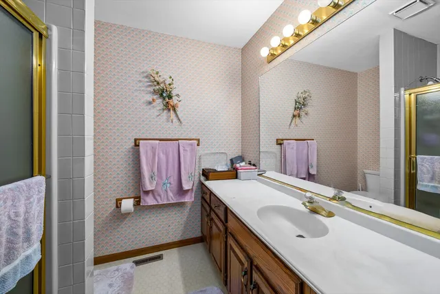 a bed sitting in a room next to a window