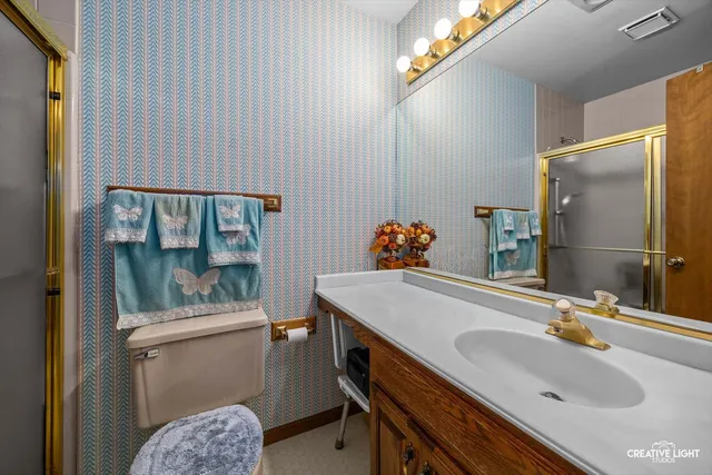 a kitchen with stainless steel appliances granite countertop a stove a sink dishwasher and a microwave oven with cabinets