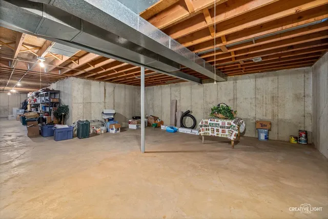 a view of a patio with table and chairs near a yard