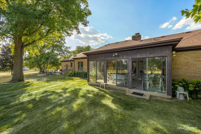 a swimming pool with outdoor seating and yard