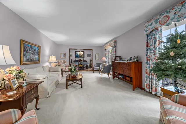 a living room with furniture and a lamp