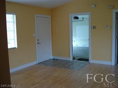 9100 Henry Road Fort Myers, FL 33967 - Photo 2 of 10 an empty room with windows