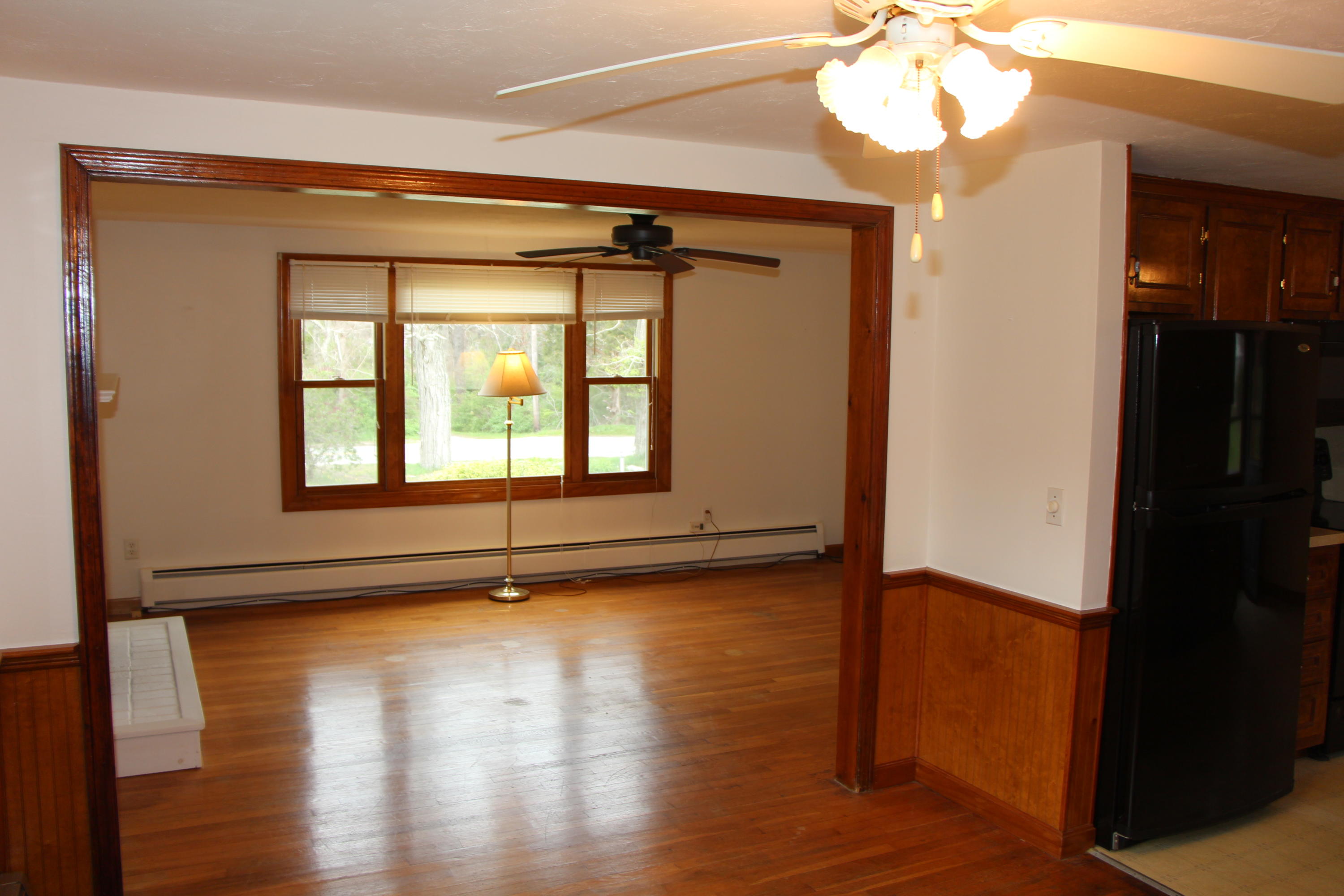 265 County Road Monument Beach, MA 02532 - Photo 12 of 35 a view of an empty room with wooden floor and a window