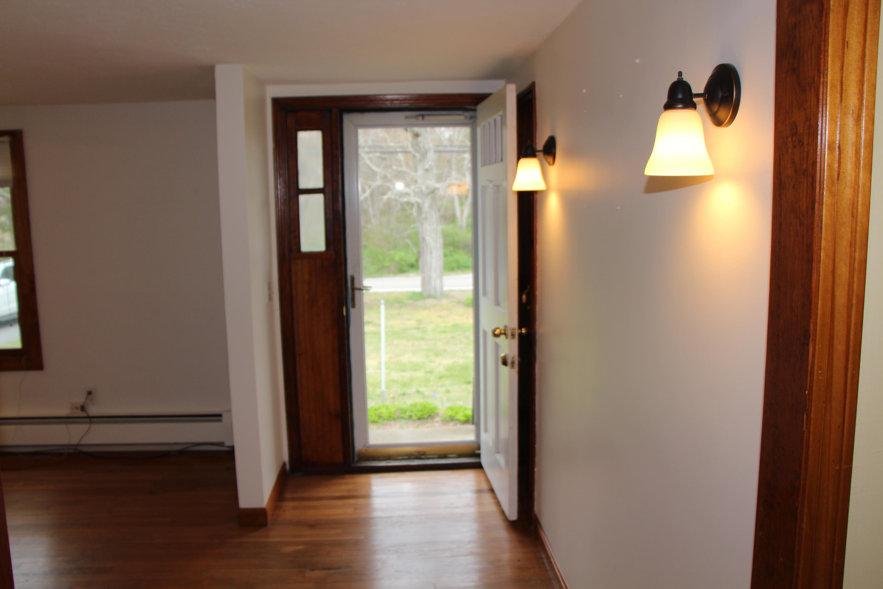 265 County Road Monument Beach, MA 02532 - Photo 17 of 35 an entryway of a house with wooden floor and windows
