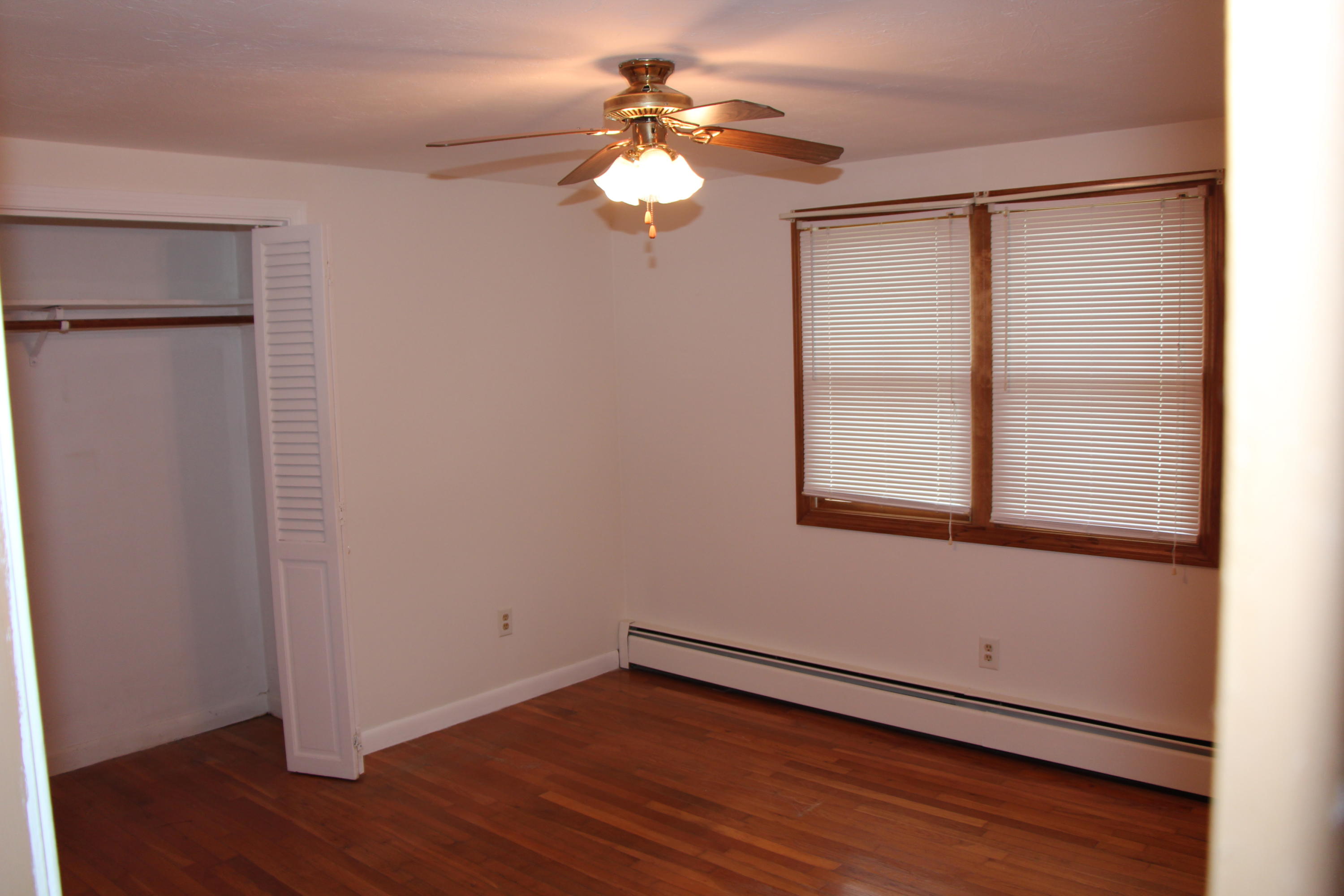 265 County Road Monument Beach, MA 02532 - Photo 23 of 35 a view of a room with wooden floor and a window