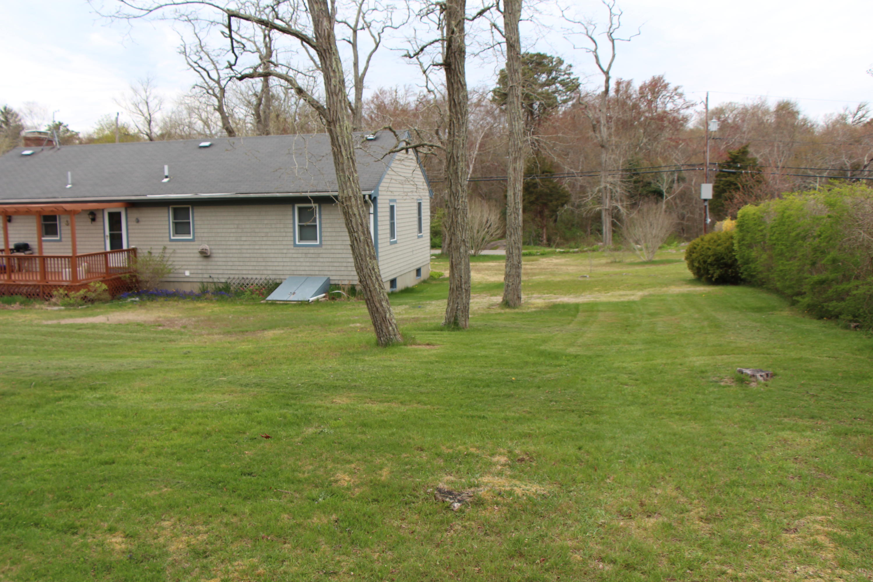 265 County Road Monument Beach, MA 02532 - Photo 7 of 35 a view of a house with a backyard