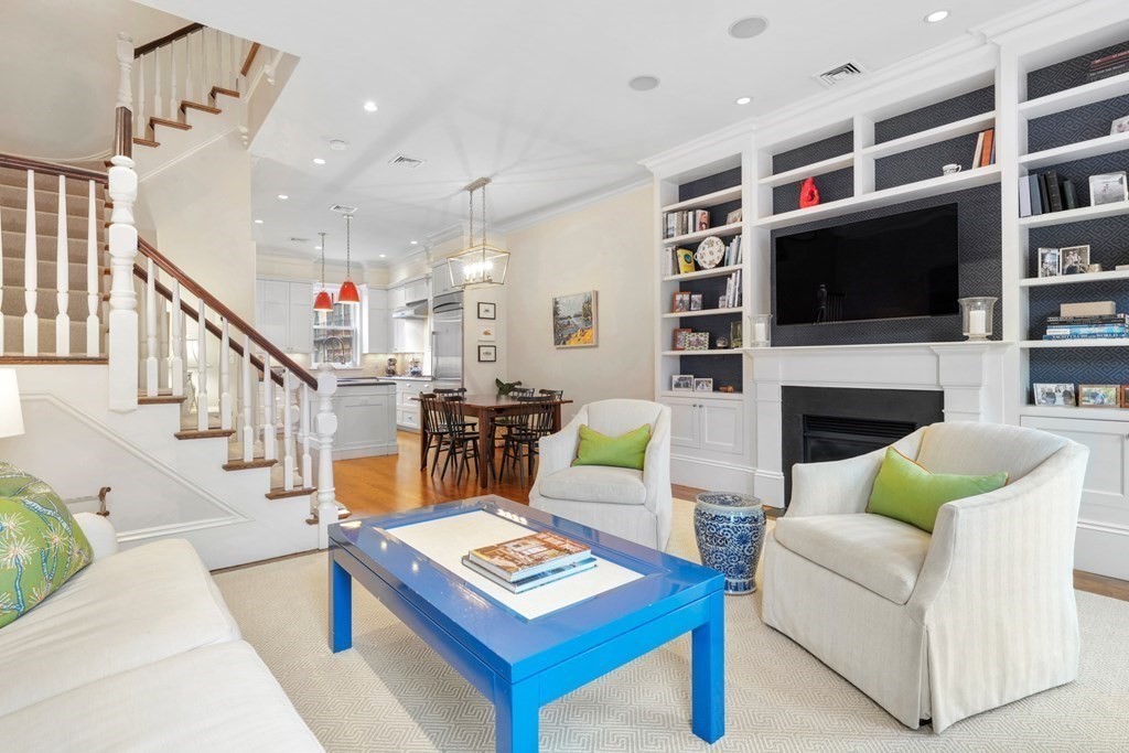 a living room with furniture fireplace and flat screen tv