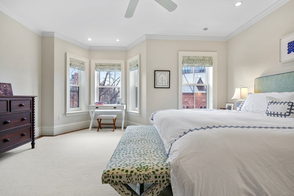 173 Warren Avenue, Unit 2 Boston, MA 02116 - Photo 12 of 32 a bedroom with a bed and wooden floor