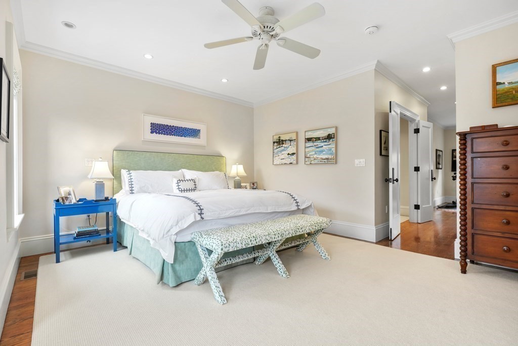 173 Warren Avenue, Unit 2 Boston, MA 02116 - Photo 14 of 32 a bedroom with a bed and a table