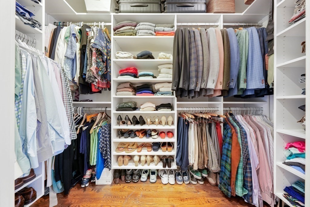 173 Warren Avenue, Unit 2 Boston, MA 02116 - Photo 17 of 32 a view of walk in closet with clothes and shoes