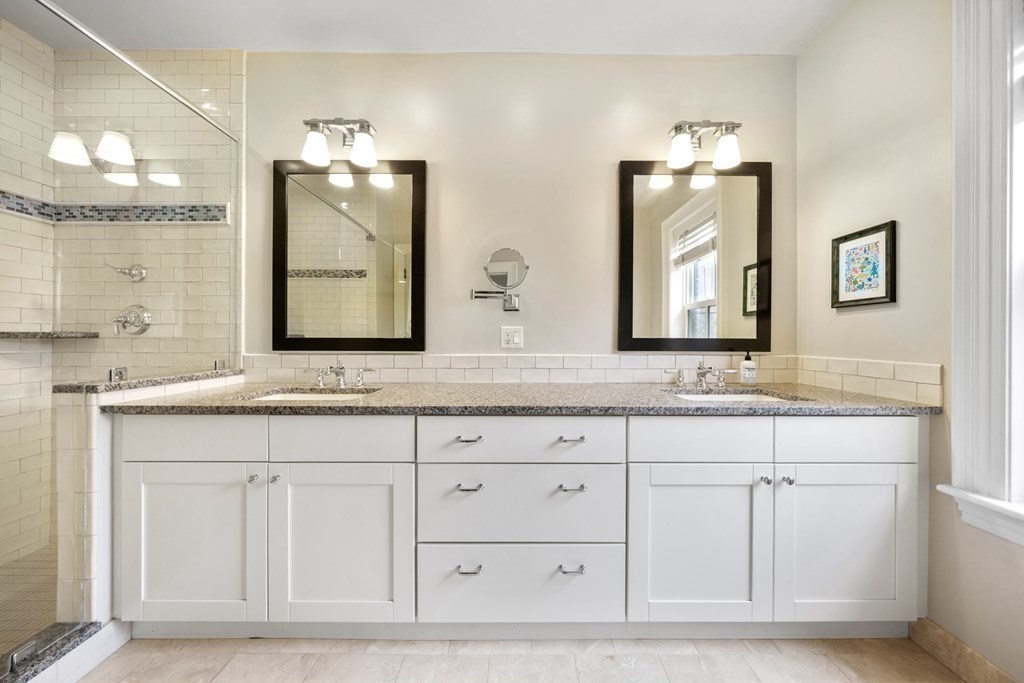173 Warren Avenue, Unit 2 Boston, MA 02116 - Photo 18 of 32 a bathroom with white cabinets and sink