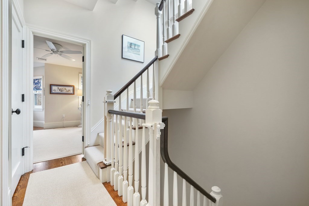 173 Warren Avenue, Unit 2 Boston, MA 02116 - Photo 20 of 32 a view of staircase with railing and white walls