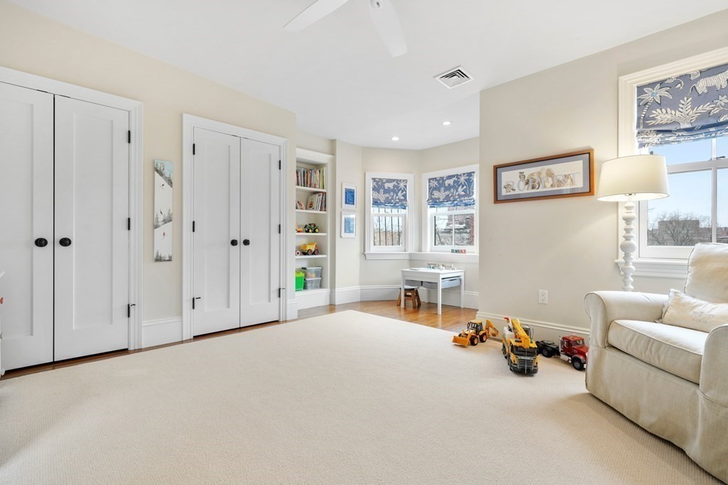 173 Warren Avenue, Unit 2 Boston, MA 02116 - Photo 22 of 32 a view of a livingroom with furniture and windows