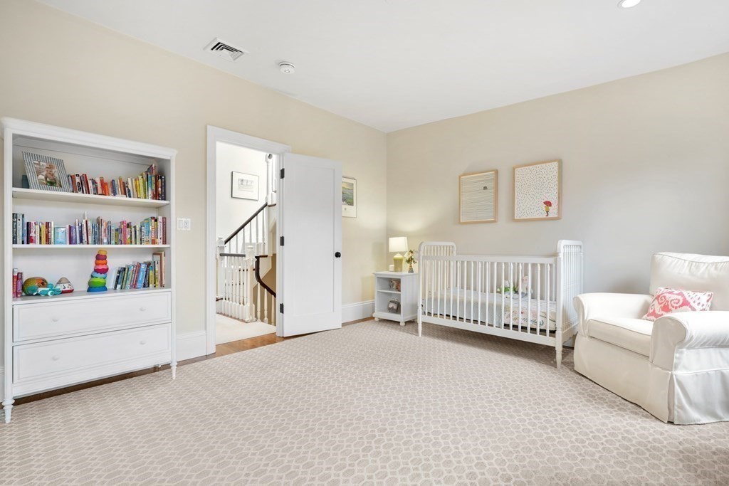 173 Warren Avenue, Unit 2 Boston, MA 02116 - Photo 25 of 32 a view of a bedroom with baby crib and a bathtub