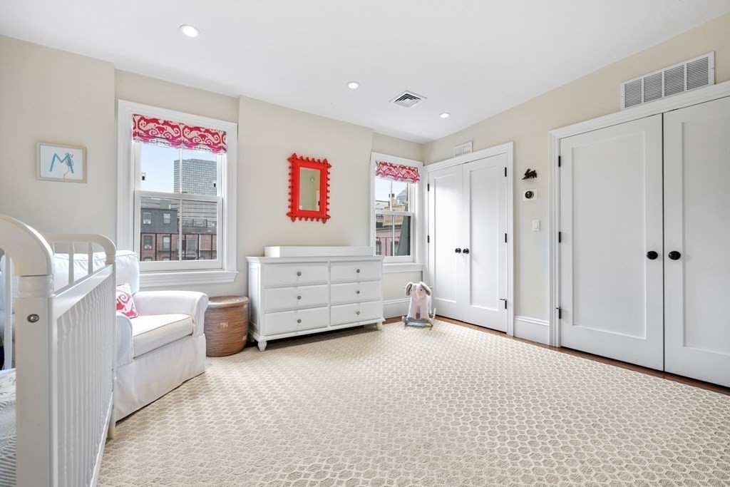 173 Warren Avenue, Unit 2 Boston, MA 02116 - Photo 26 of 32 a room with furniture and window