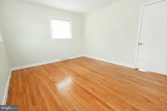 a view of an empty room with stairs