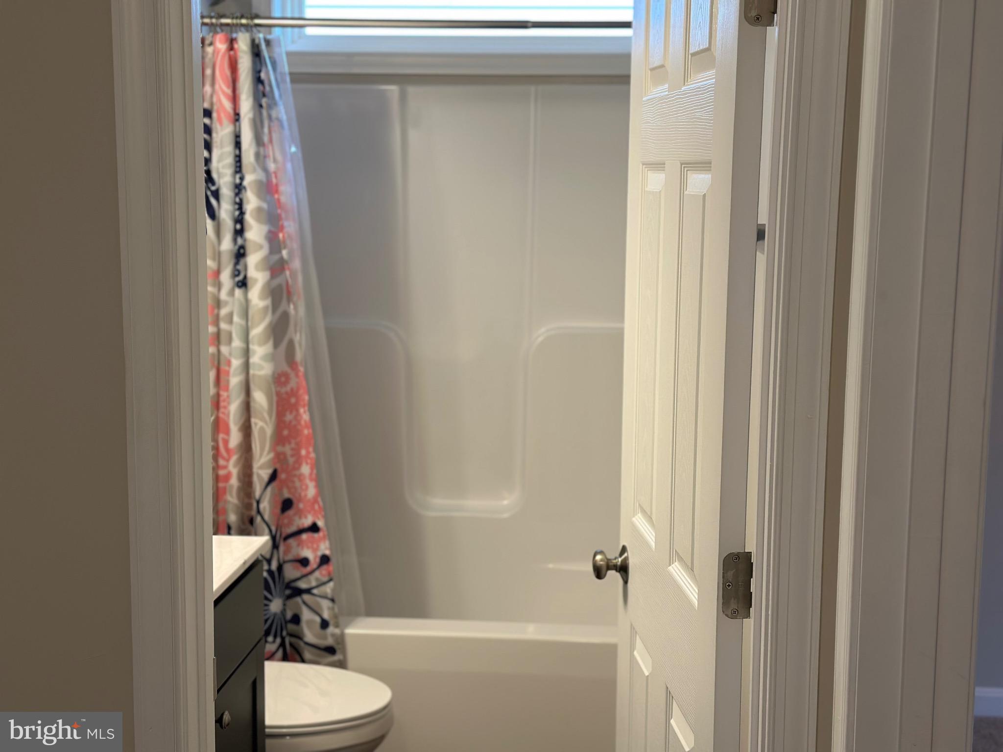 275 Nicholson Drive Colonial Beach, VA 22443 - Photo 18 of 22 a bathroom with a shower curtain