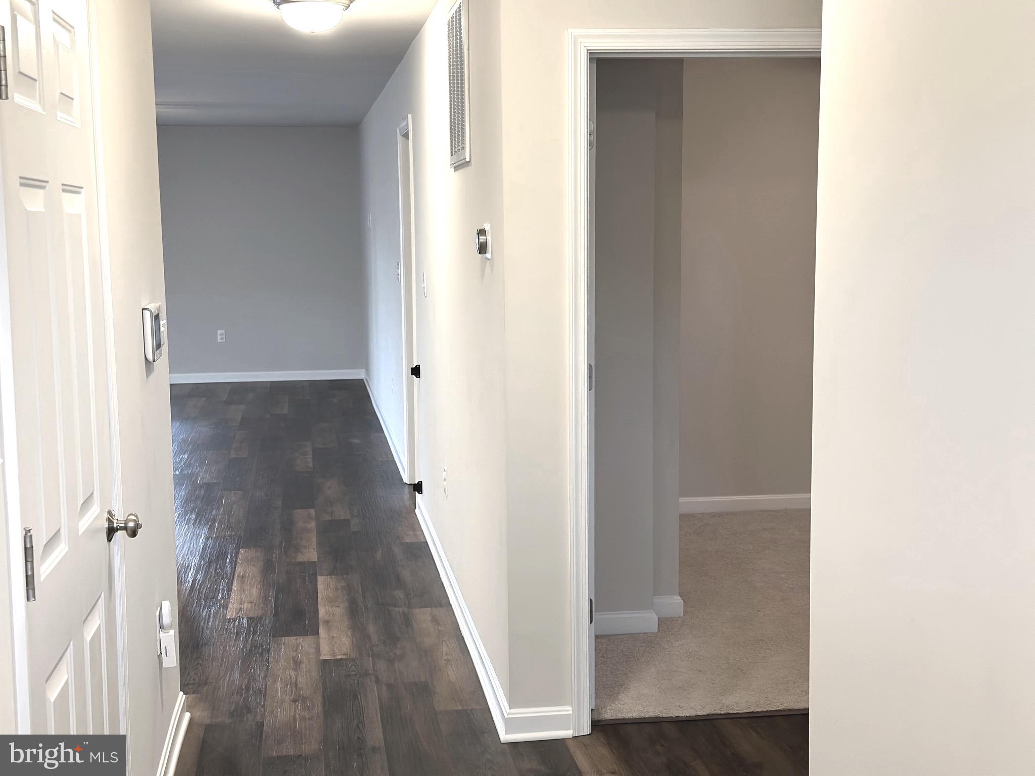 275 Nicholson Drive Colonial Beach, VA 22443 - Photo 9 of 22 a view of a hallway with wooden floor