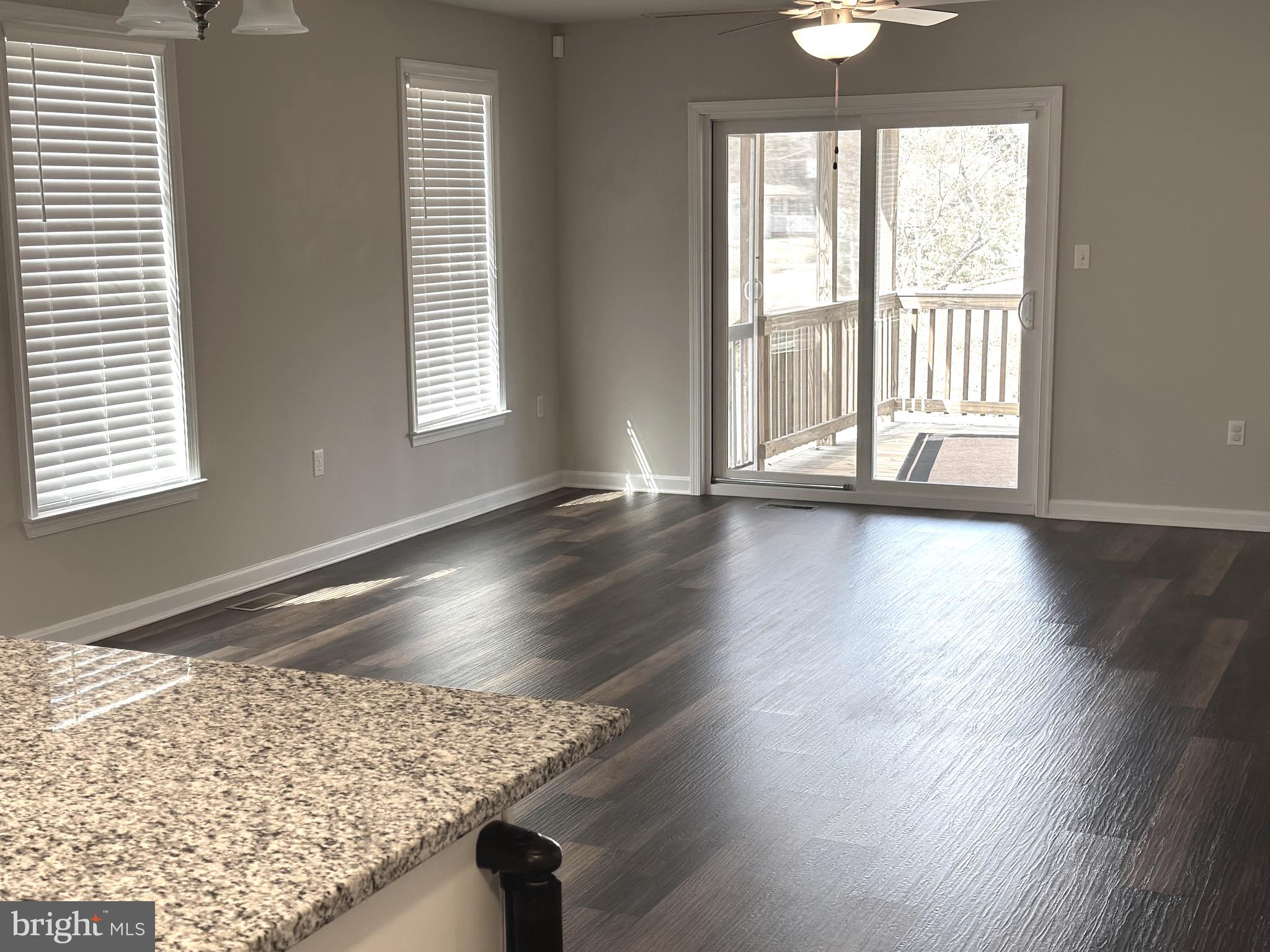 275 Nicholson Drive Colonial Beach, VA 22443 - Photo 10 of 22 a view of wooden floor and cabinet in an empty room