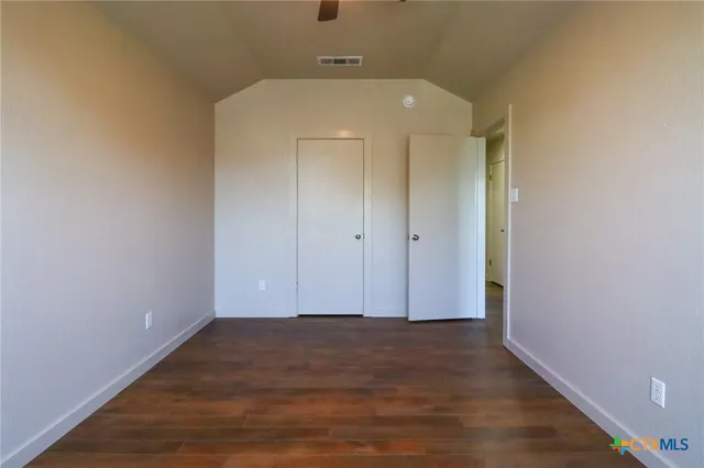 a view of room with wooden floor