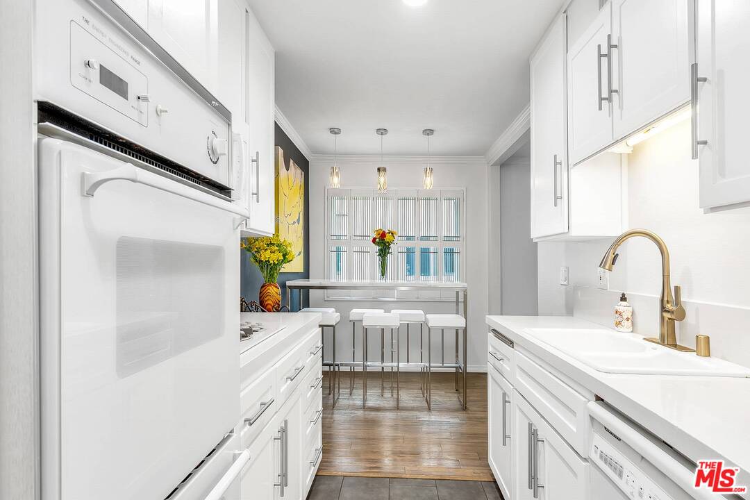 13035 Mindanao Way, Unit 2 Marina del Rey, CA 90292 - Photo 12 of 29 a kitchen with a sink appliances cabinets and a window