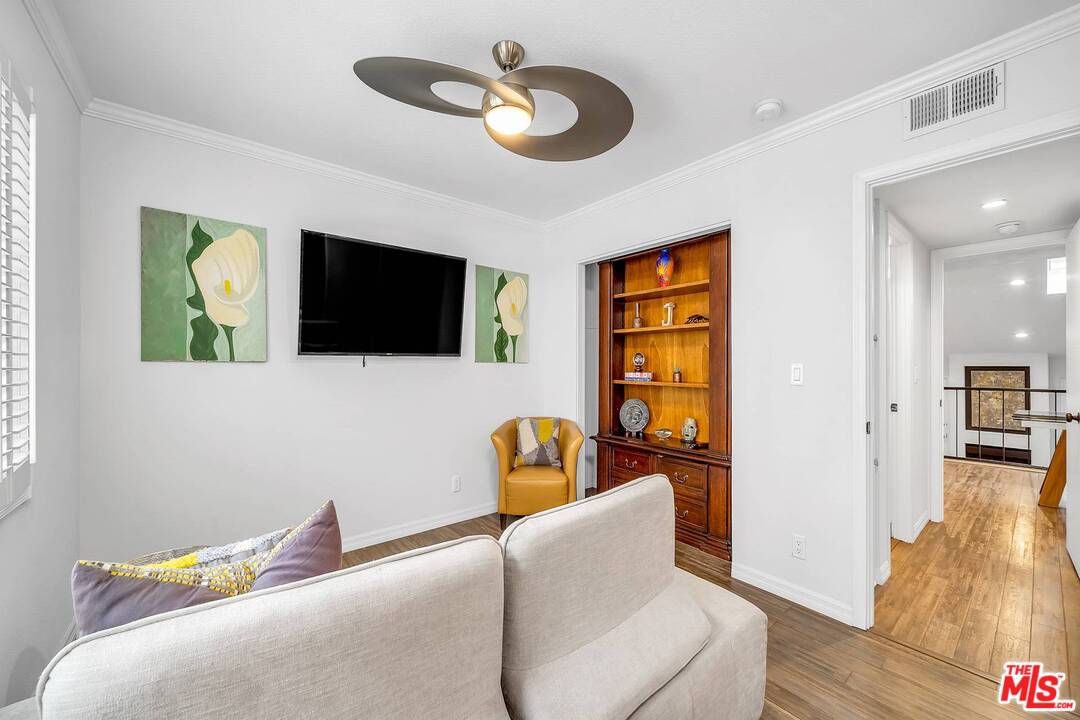 13035 Mindanao Way, Unit 2 Marina del Rey, CA 90292 - Photo 15 of 29 a living room with furniture and a flat screen tv