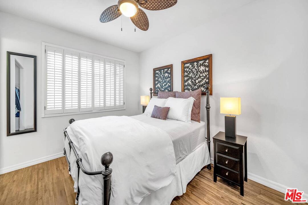 13035 Mindanao Way, Unit 2 Marina del Rey, CA 90292 - Photo 17 of 29 a bedroom with a bed and wooden floor