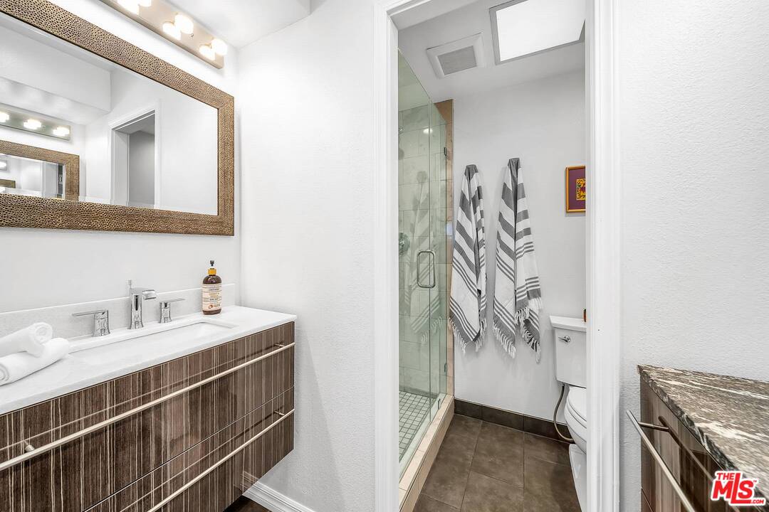 13035 Mindanao Way, Unit 2 Marina del Rey, CA 90292 - Photo 20 of 29 a bathroom with a sink a vanity and a mirror