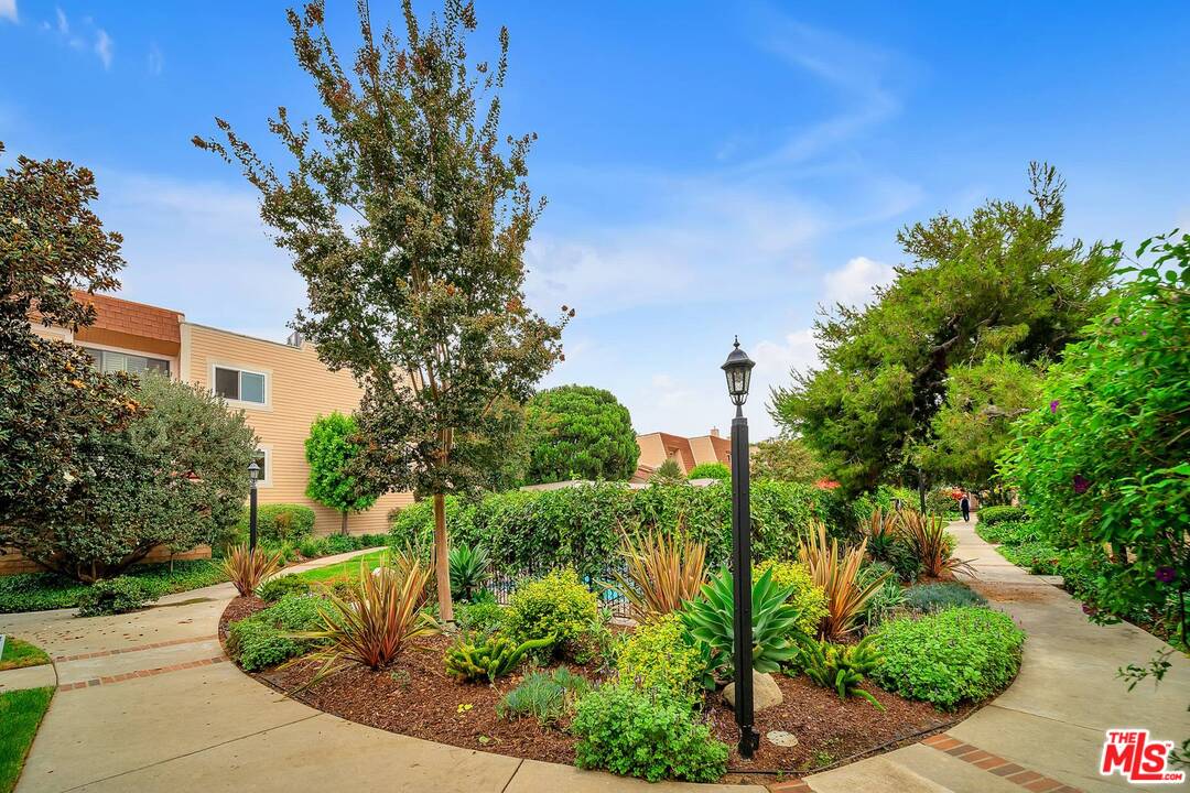 13035 Mindanao Way, Unit 2 Marina del Rey, CA 90292 - Photo 24 of 29 a view of a garden with plants and large trees