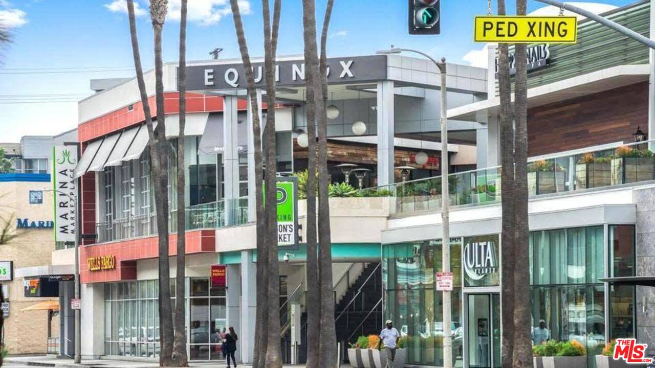 13035 Mindanao Way, Unit 2 Marina del Rey, CA 90292 - Photo 28 of 29 a city street lined with tall buildings