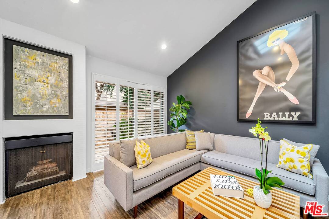 13035 Mindanao Way, Unit 2 Marina del Rey, CA 90292 - Photo 5 of 29 a living room with furniture and a fireplace