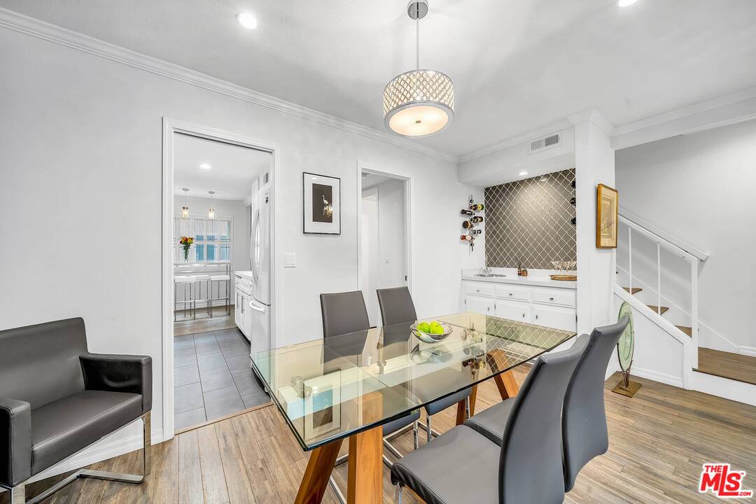 13035 Mindanao Way, Unit 2 Marina del Rey, CA 90292 - Photo 8 of 29 a view of a dining room with furniture and wooden floor