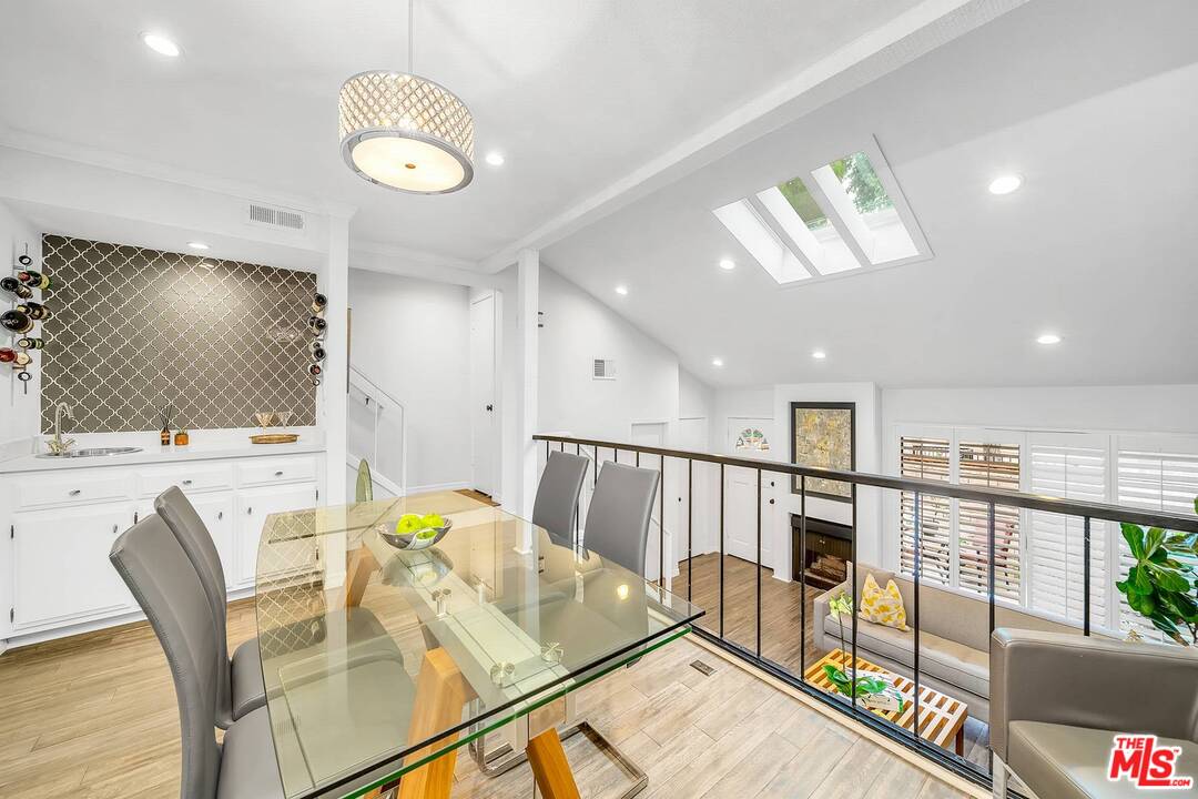 13035 Mindanao Way, Unit 2 Marina del Rey, CA 90292 - Photo 9 of 29 a living room with dining table furniture and a flat screen tv
