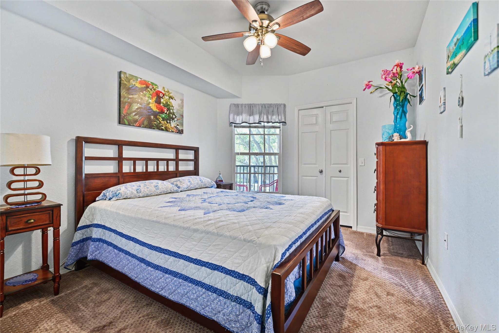 5174 Northridge Road, Unit 211 Sarasota, FL 34238 - Photo 12 of 29 a bedroom with a bed dresser and a window