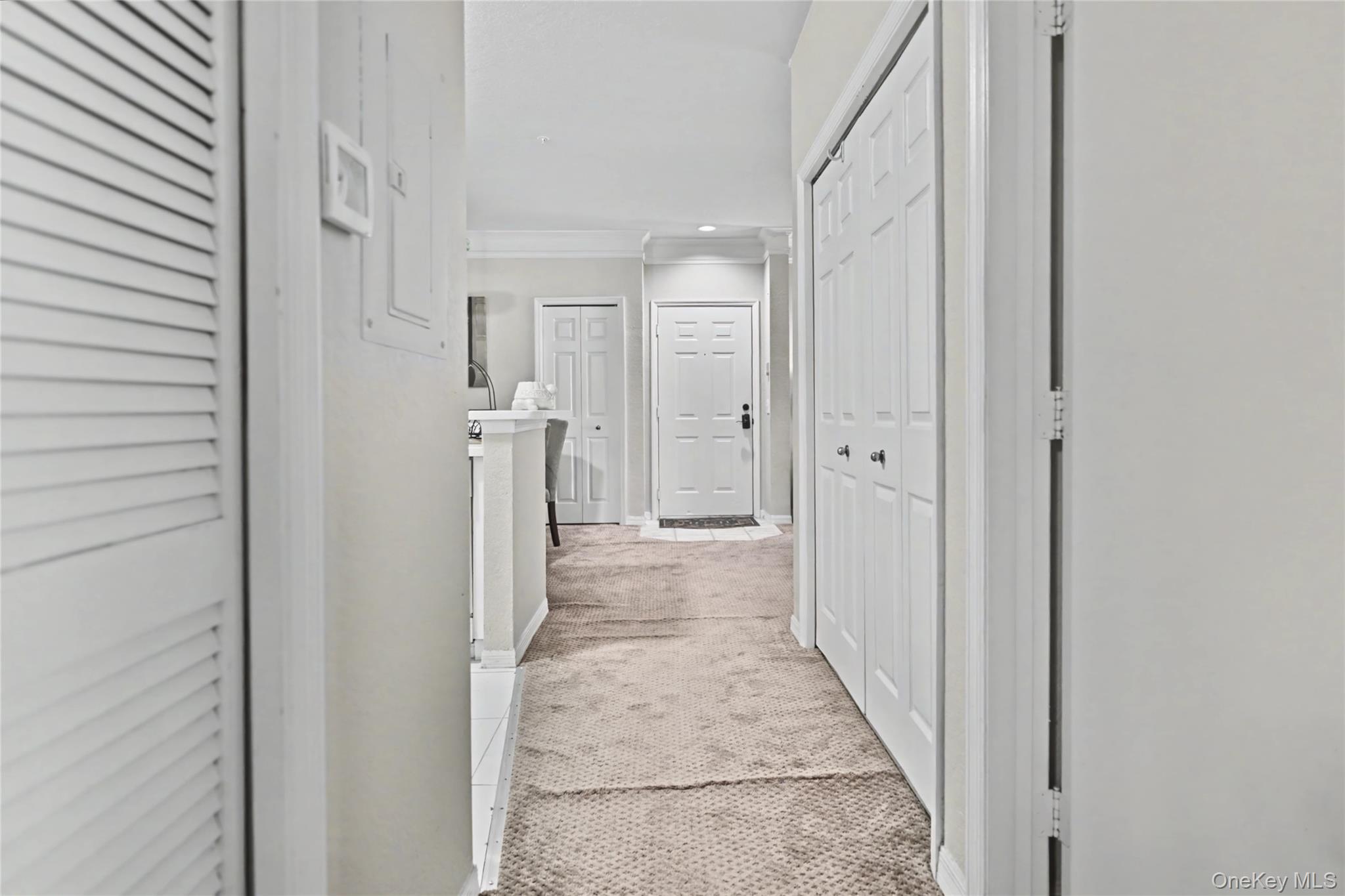 5174 Northridge Road, Unit 211 Sarasota, FL 34238 - Photo 13 of 29 a view of a hallway with wooden shelves