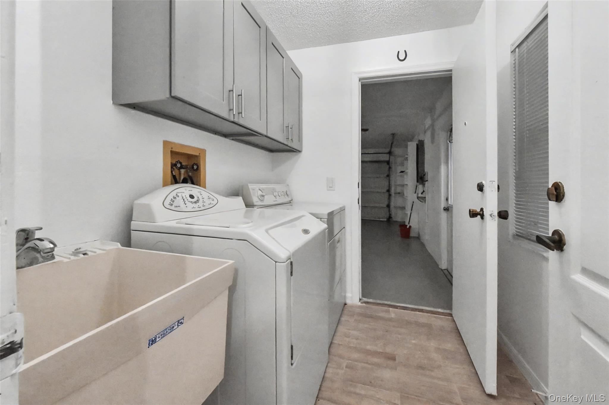 5174 Northridge Road, Unit 211 Sarasota, FL 34238 - Photo 18 of 29 a utility room with dryer and washer
