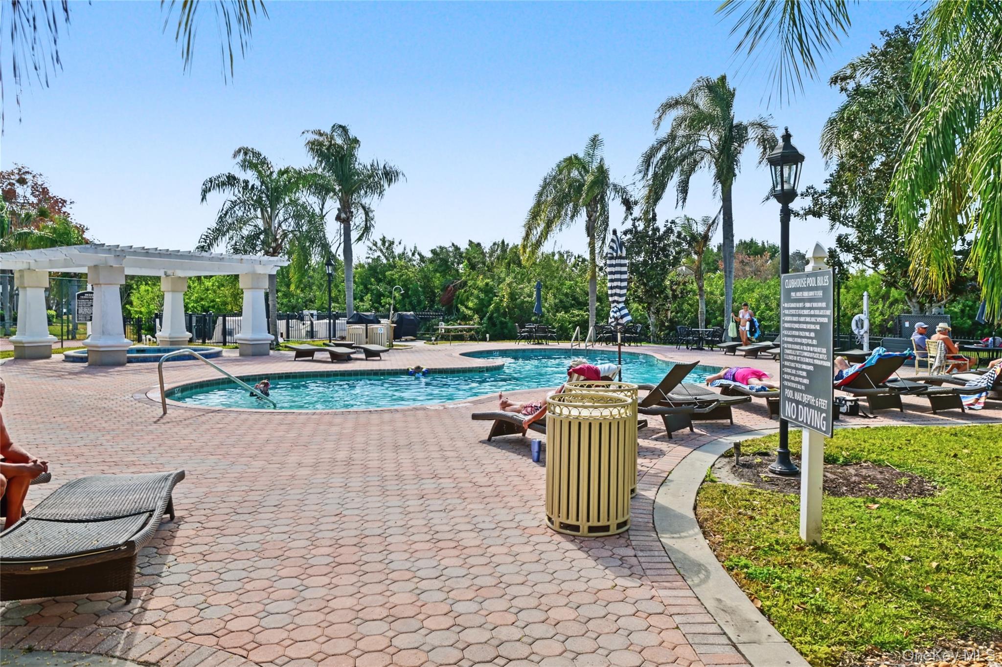 5174 Northridge Road, Unit 211 Sarasota, FL 34238 - Photo 19 of 29 a view of a park with swings and slides