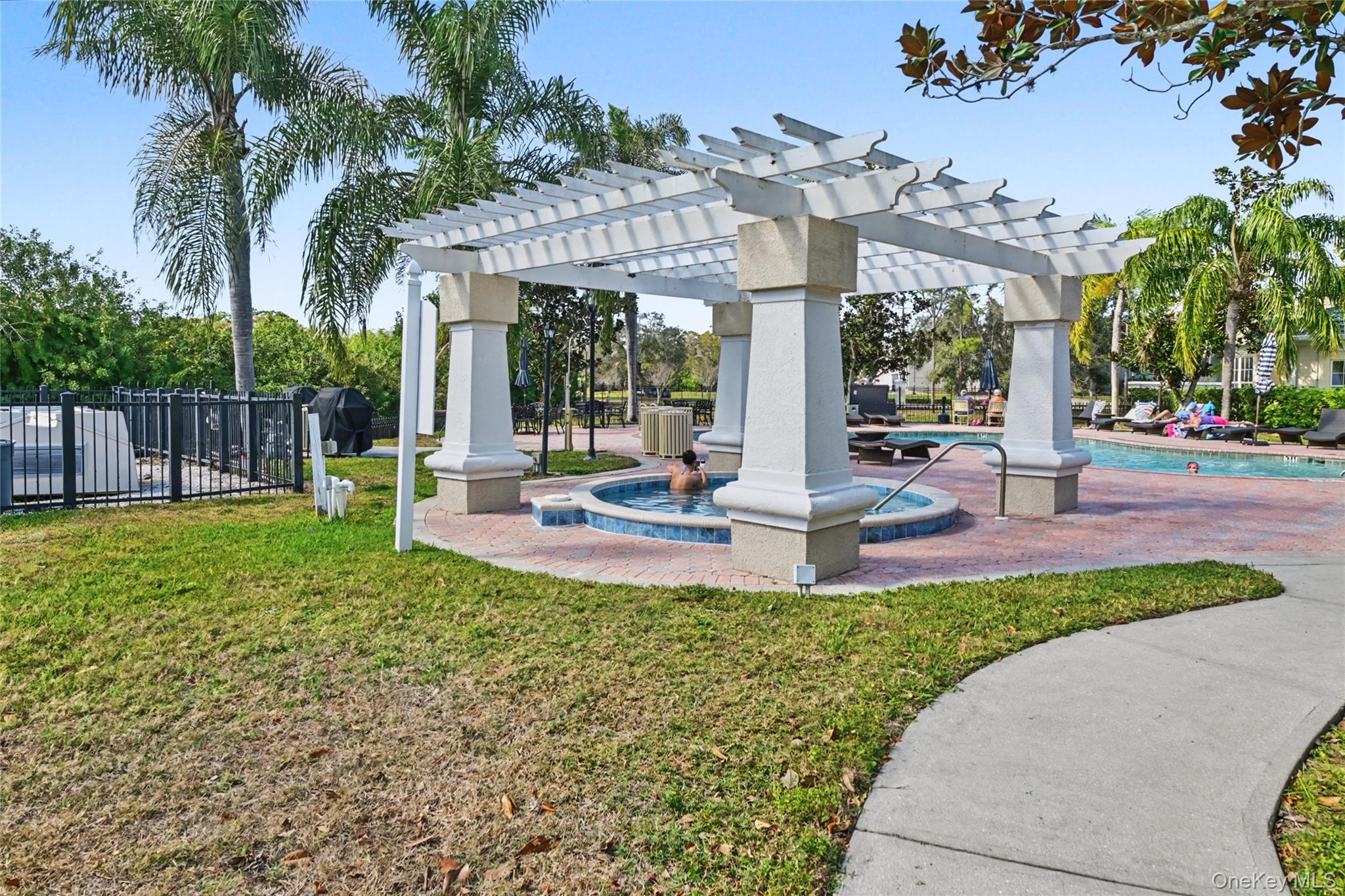5174 Northridge Road, Unit 211 Sarasota, FL 34238 - Photo 21 of 29 a view of a house with backyard and sitting area