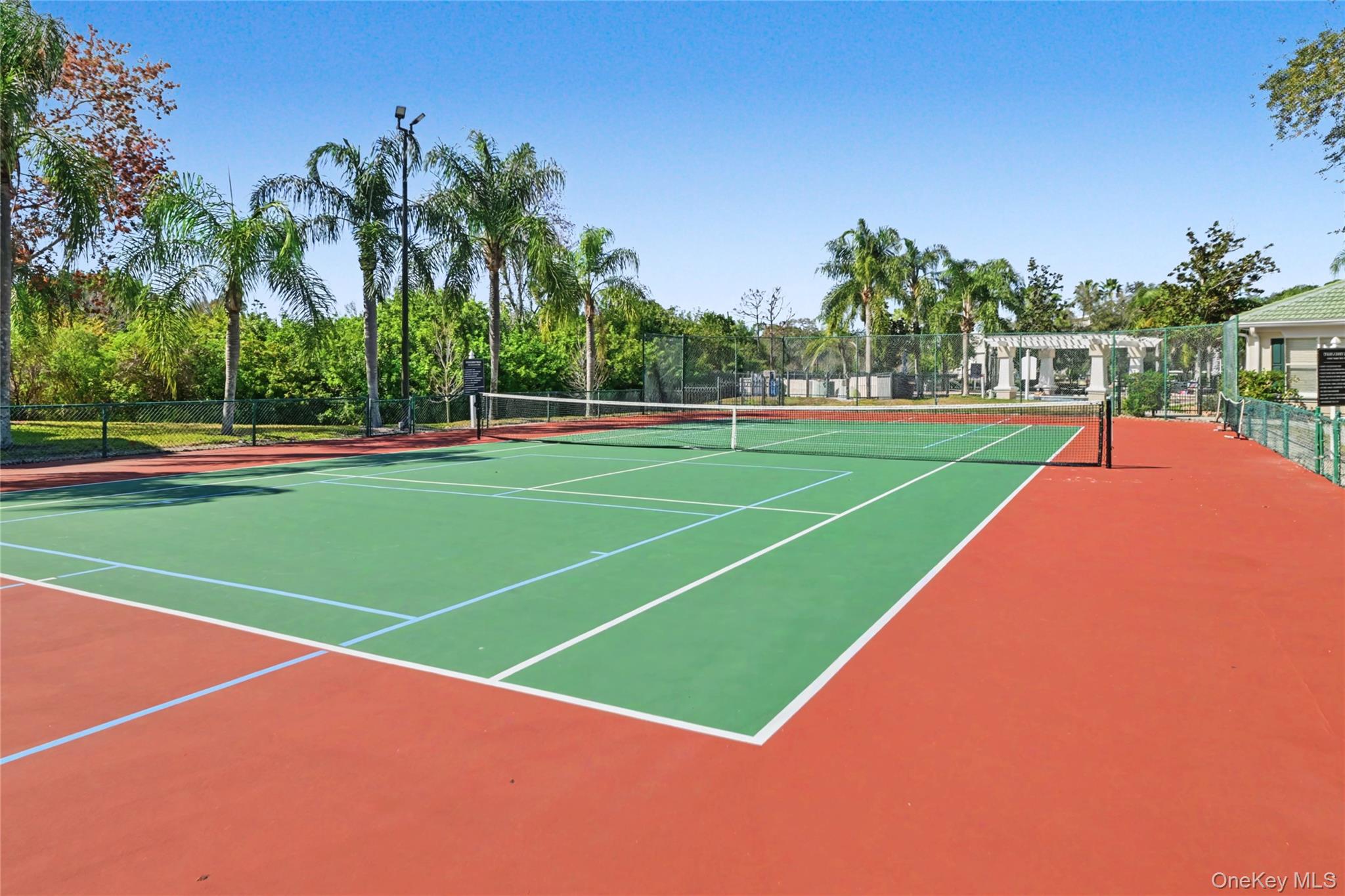 5174 Northridge Road, Unit 211 Sarasota, FL 34238 - Photo 22 of 29 a view of a tennis court