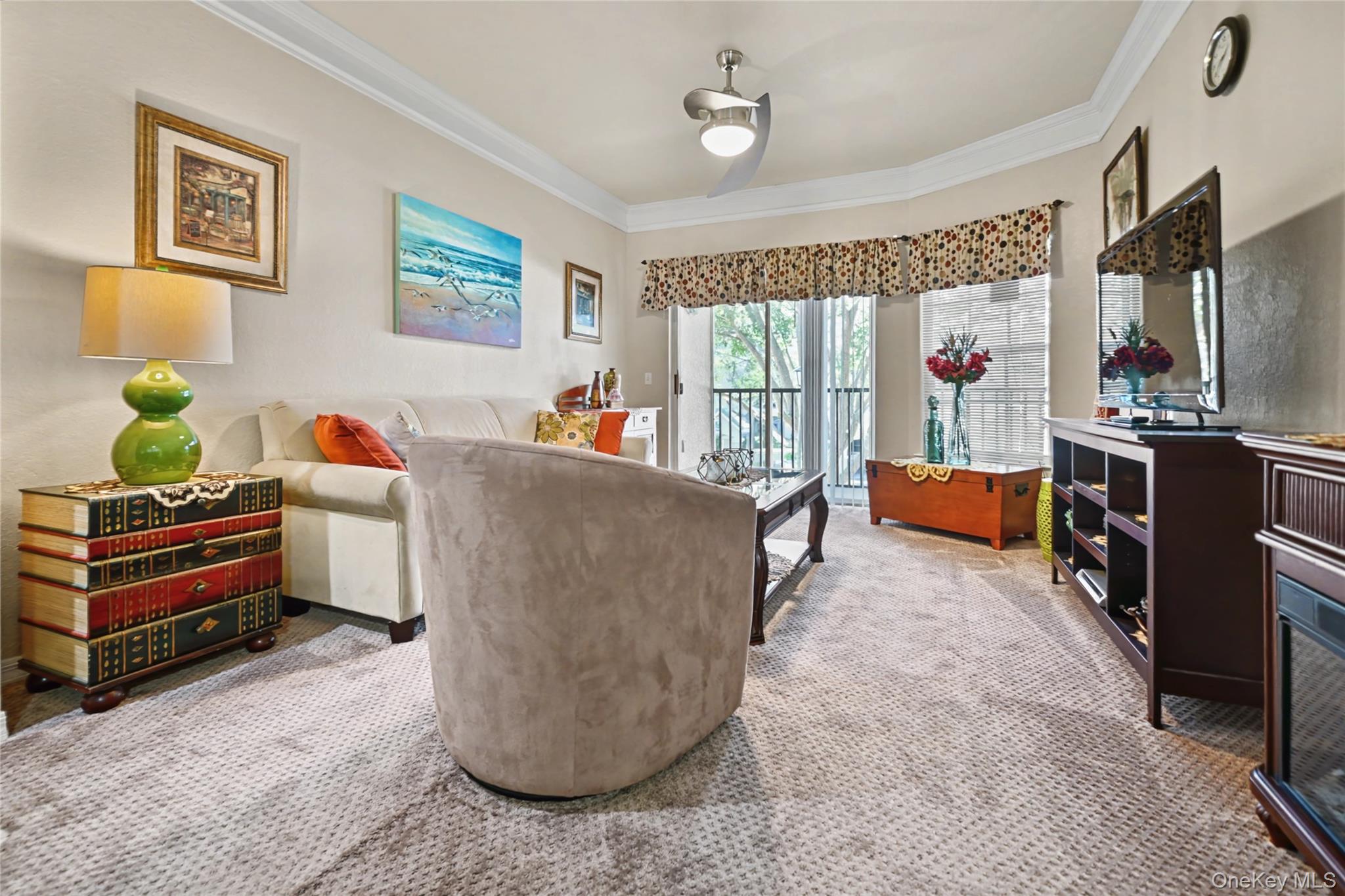 5174 Northridge Road, Unit 211 Sarasota, FL 34238 - Photo 5 of 29 a living room with furniture and a window