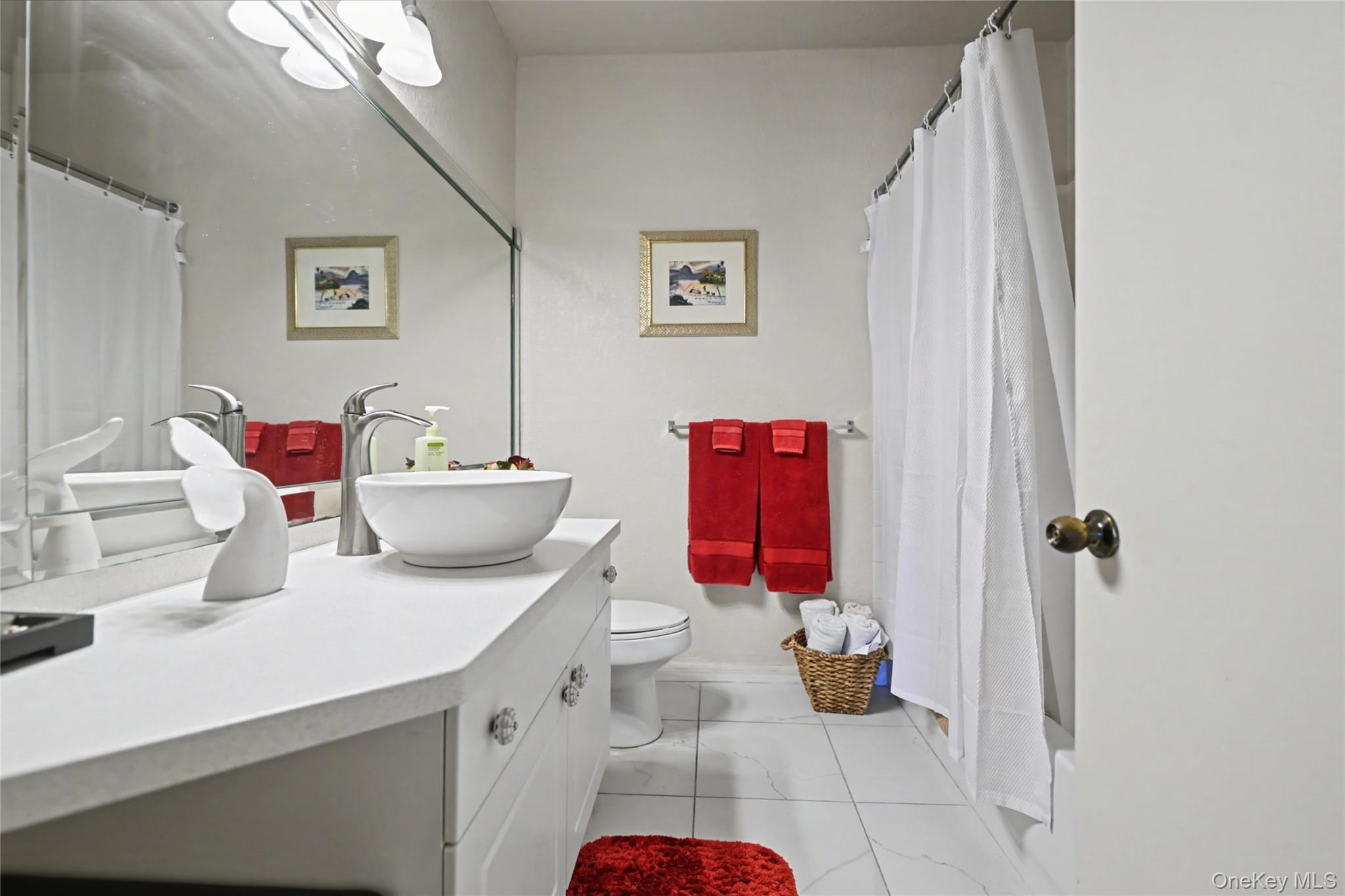 5174 Northridge Road, Unit 211 Sarasota, FL 34238 - Photo 7 of 29 a bathroom with a sink and mirror