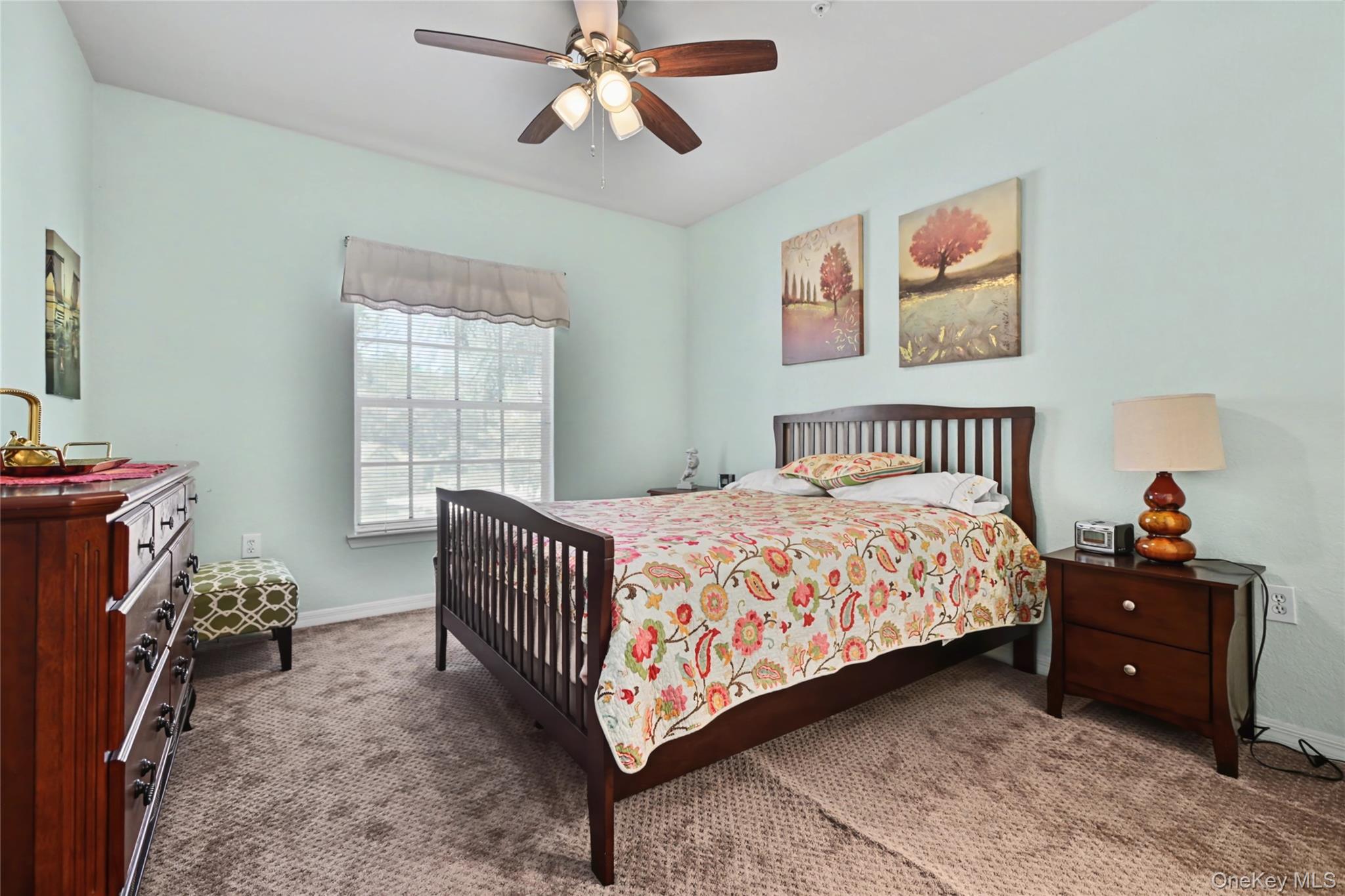 5174 Northridge Road, Unit 211 Sarasota, FL 34238 - Photo 9 of 29 a bedroom with a bed and a window