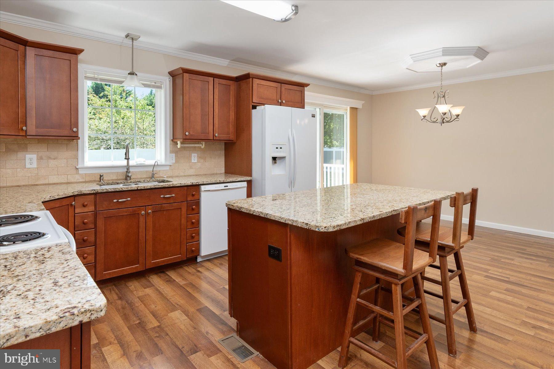 109 Calvert Road Stevensville, MD 21666 - Photo 30 of 41 Inviting kitchen with warm wood accents.
