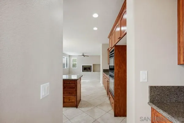 a view of a kitchen from the hallway
