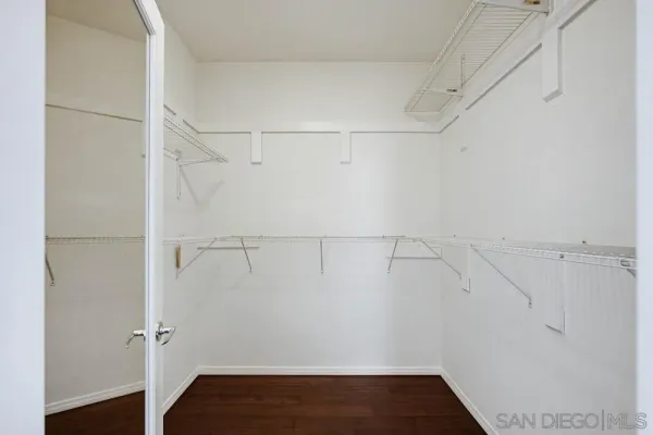 a bathroom with a granite countertop bathtub a sink and a mirror