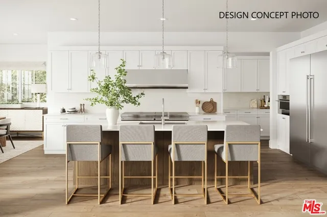 a kitchen with kitchen island granite countertop a dining table chairs and white cabinets