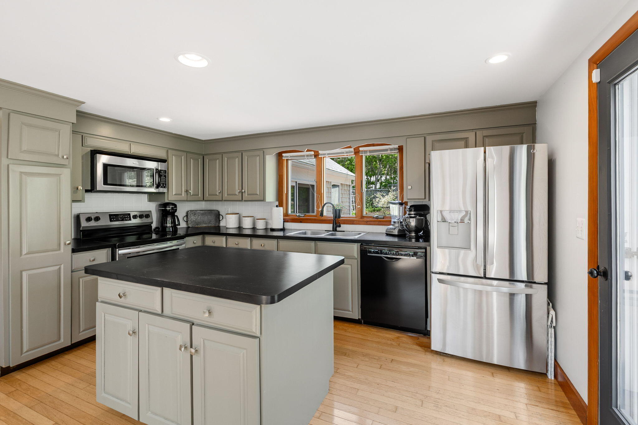 6 Paddock Drive Harwich, MA 02645 - Photo 12 of 40 a kitchen with a refrigerator stove and sink