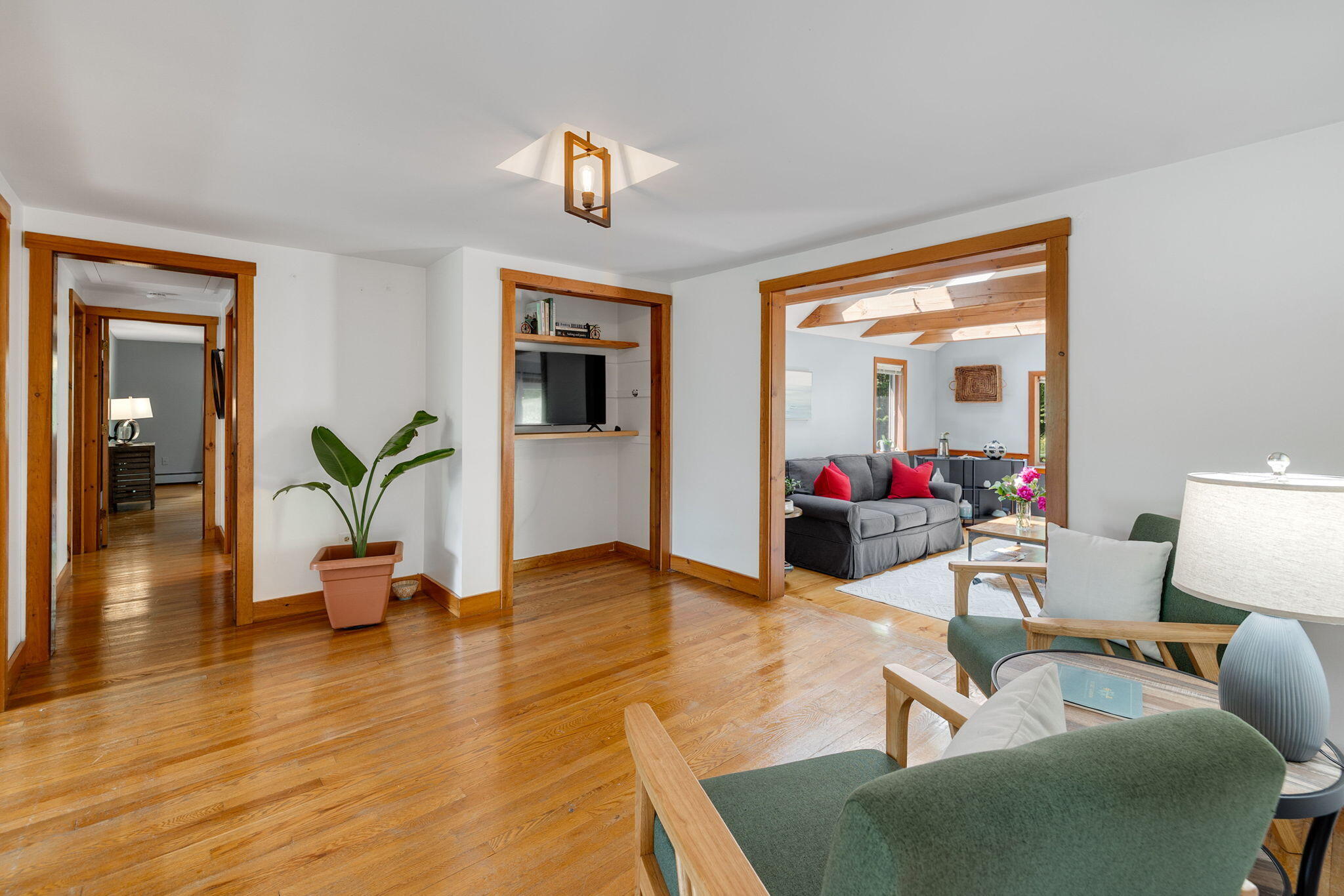 6 Paddock Drive Harwich, MA 02645 - Photo 16 of 40 a living room with furniture and a potted plant