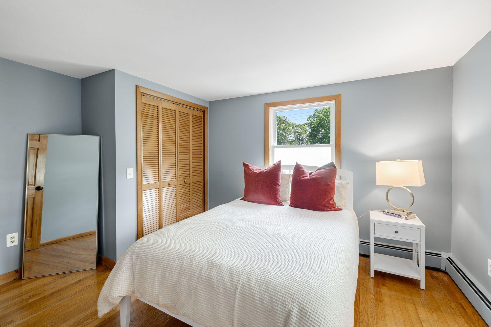 6 Paddock Drive Harwich, MA 02645 - Photo 27 of 40 a bedroom with a bed and wooden floor