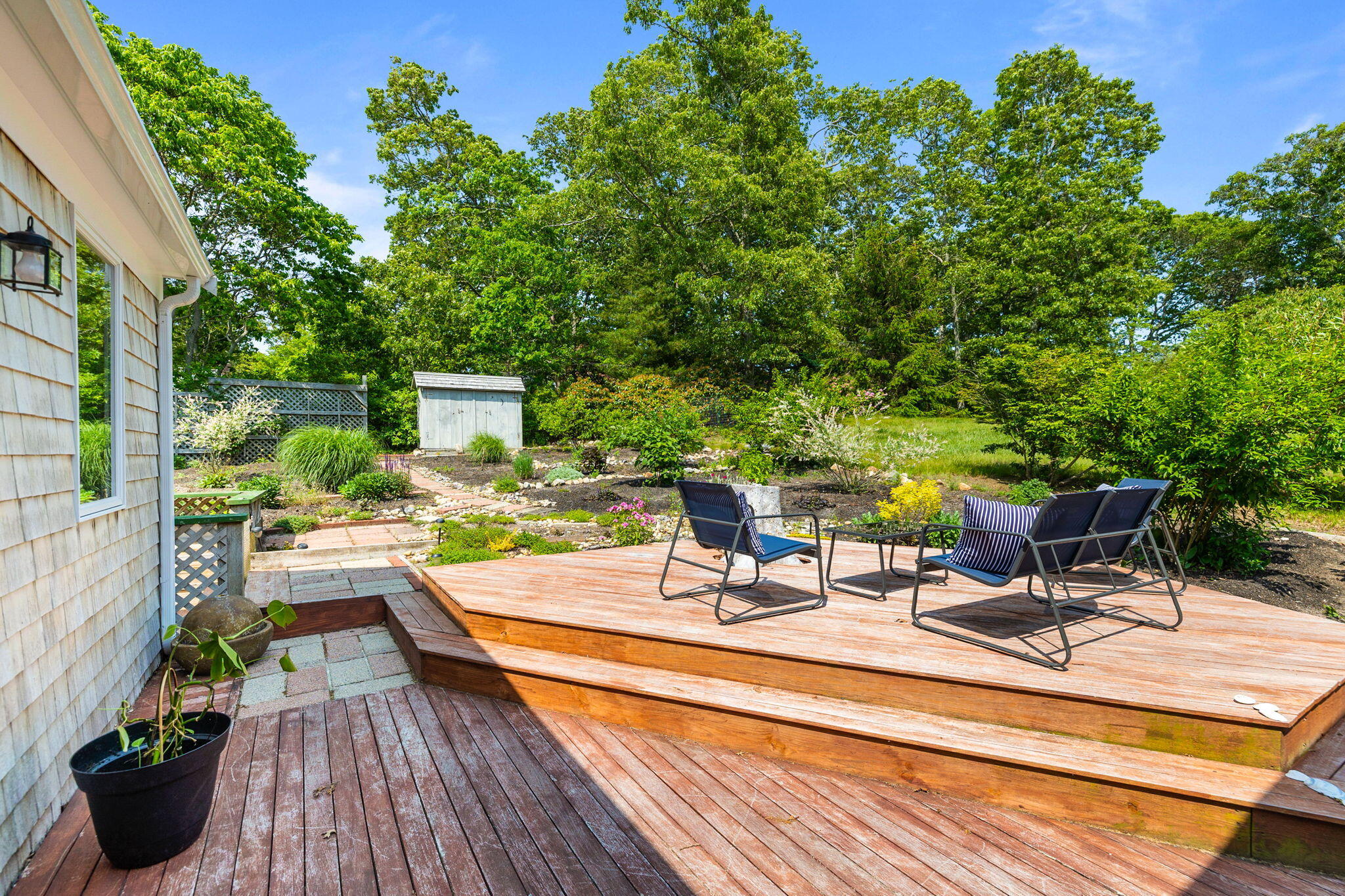 6 Paddock Drive Harwich, MA 02645 - Photo 32 of 40 a view of a backyard with sitting area